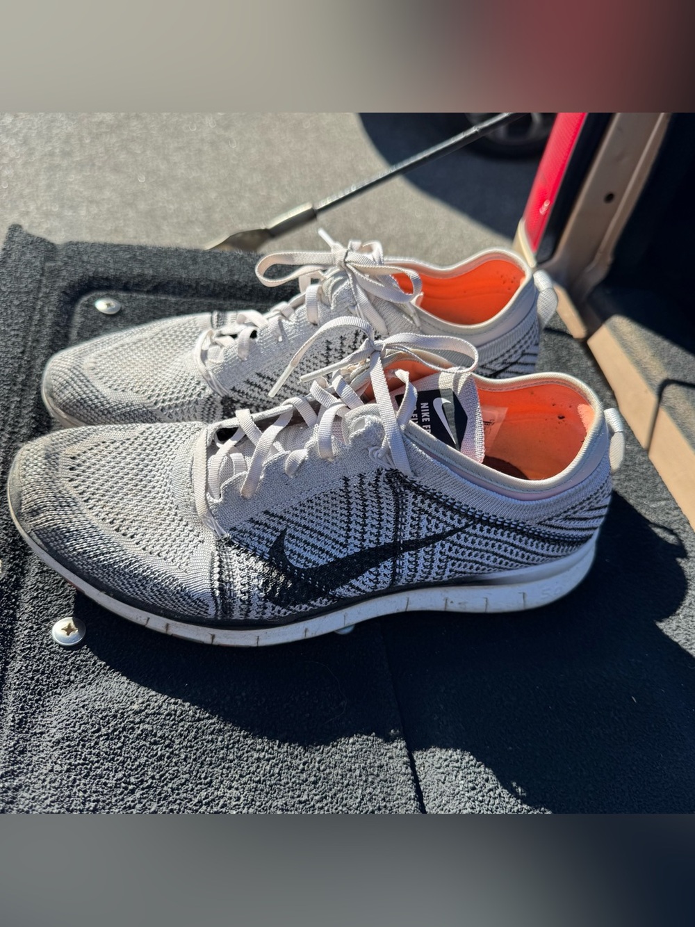 Nike Women's Free TR 5 Flyknit sneakers in the white, pure platinum, and black